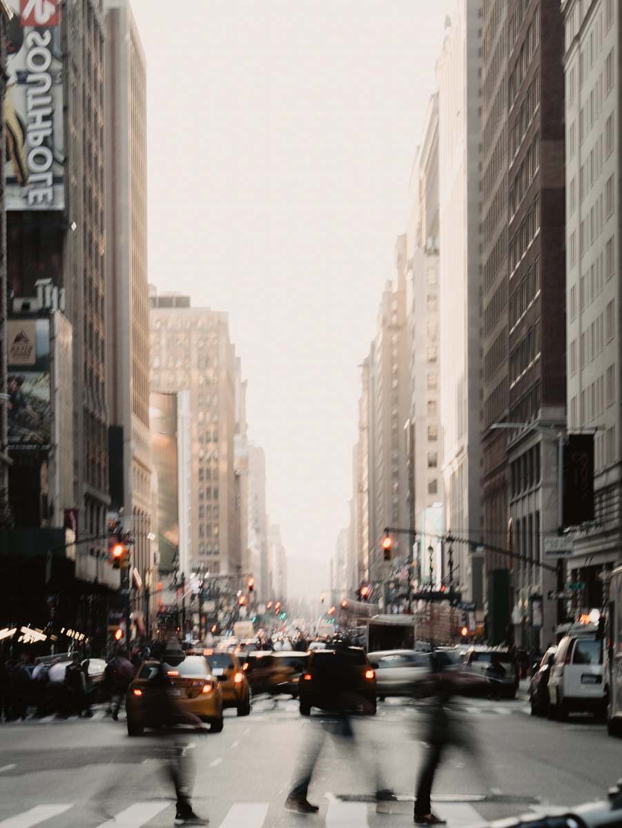 new york people walking near road between high-rise building during daytime car